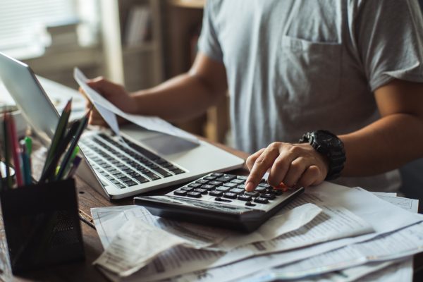 man-calculating-finances-budget
