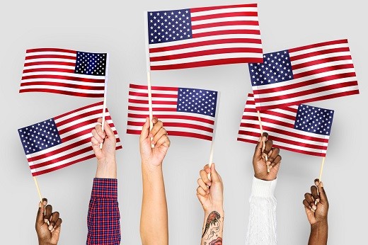 U.S. flags held by hand - Educators Financial Group