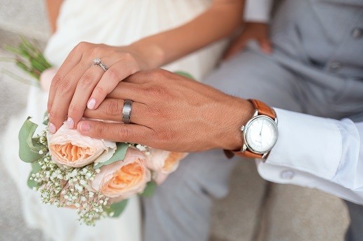 Two hands in wedding - Educators Financial Group