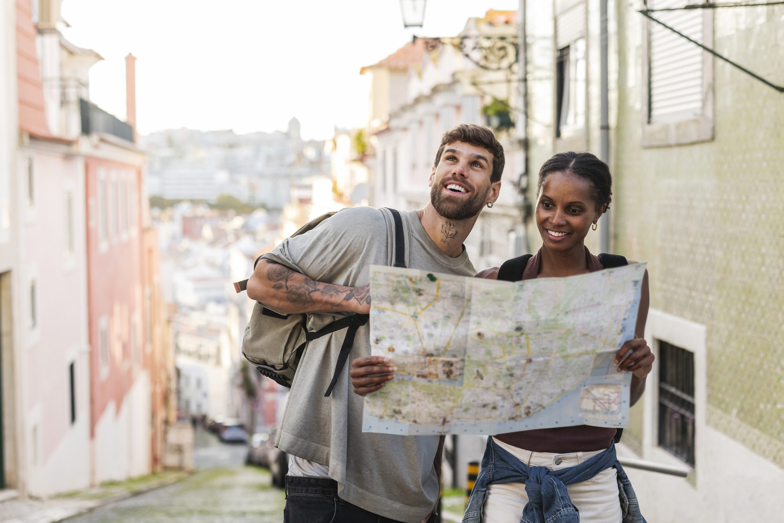 Tourists consulting a map in the charming streets of lisbon, portugal